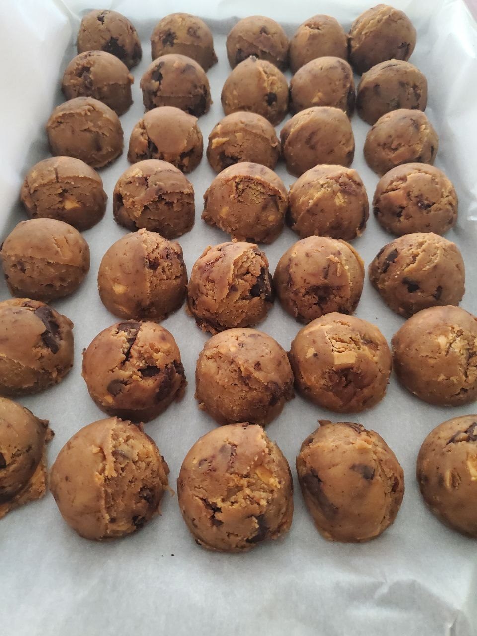 Take and bake cookie dough pucks on a tray